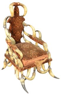 Horn Armchair, having Victorian upholstery, height 41 inches, width 23 inches.