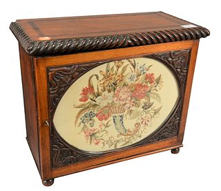 English Regency Collectors Cabinet, having one door with needlepoint panel, opening to two over two over three drawers, all on ball feet, 19th century