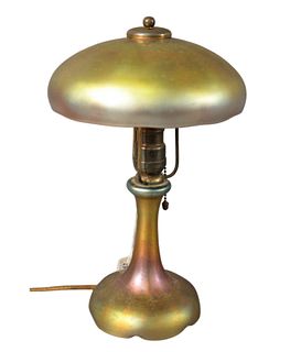 Art Glass Boudoir Lamp, having gold iridescent dome shade over glass base, unmarked, height 14 inches, diameter of shade 8 1/2 inches.