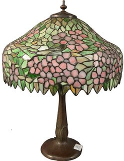 Handel Leaded Glass Table Lamp, having apple blossom shade, marked Handel on bronze base, with two sockets, height 20 1/2 inches, diameter 16 inches.
