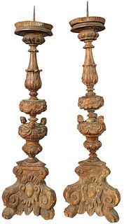 Pair of Italian Carved Wood Pickets, having three carved heads on each, height 32 1/2 inches, width 8 inches.