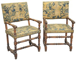 Pair of Jacobean Walnut Arm Chairs, having carved hand supports and Aubusson upholstered backs and seats, on turned legs and supports, probably early 