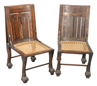 Pair of Egyptian Revival Side Chairs, having caned seats and paw feet, height 33 inches, width 16 inches, (seat height 14 inches).