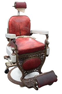 Theo Koch Barber Chair, having porcelain arms, (back support bracket broken), full height 49 inches, full width 28 inches.
