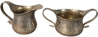 Tiffany and Company Sterling Silver Sugar Bowl and Creamer, both having hand-hammered finish and scrolling handles, both marked 'Tiffany and Company 6
