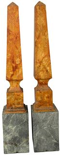 Pair of Orange Painted Wooden Obelisks mounted on green hardstone bases, height 35 inches, width 5 3/4 inches, depth 6 inches.