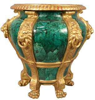 English Faux Malachite Gilt Decorated Jardiniere having lion form handles ending in paw feet, height 18 inches, diameter 15 1/2 inches.