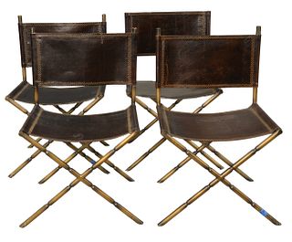 Set of Four Leather Chairs having faux brass metal frames, height 34 inches, width 23 inches.