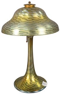 Tiffany Studios Favrile Glass Table Lamp having stepped dome shade with Favrile wave pattern in yellow, green, blue, and gold iridescence, resting on 