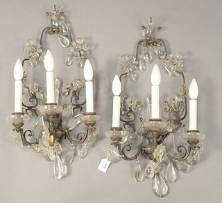 Pair of French Bronze and Rock Crystal Three Light Wall Sconces, having rock crystal drops and flower forms, length 22 inches, width 12 inches.