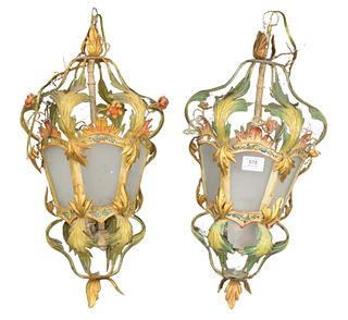 Pair of Italian Painted Tole and Glass Lanterns having flower and leaf decorations, height 22 inches, width 9 inches.