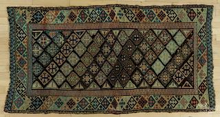 Kurdish carpet, early 20th c., 6'5'' x 3'5''.
