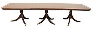 Duncan Phyfe Style Triple Pedestal Dining Table, having banded inlay top, along with brass capped feet, height 29 1/2 inches, with two leaves, top 44"