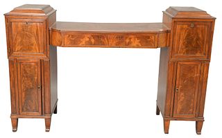 English Regency Mahogany Sideboard, having center drawer flanked by top door and drawer over doors, 19th century, height 42 inches, length 65 inches.