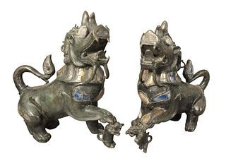 Pair of Bronze Foo Dogs, having colored glass inlay, height 16 inches, width 15 1/2 inches, depth 8 inches, (areas of loss throughout the pair).