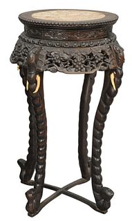 Chinese Teak Stand, having inset rouge marble and elephant supports, height 31 inches, diameter 15 inches.