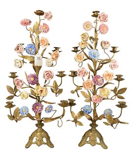 Pair of Brass Candelabras, having painted porcelain flowers, each with seven candle holders, overall height 31 inches, width 13 1/2 inches.
