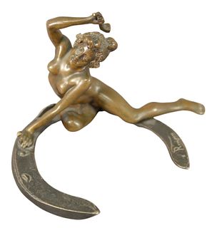 Georges Recipon (French, 1860-1920), female nude on a horseshoe, bronze with brown patina, inscribed "Recipon" with a foundry stamp on the horseshoe, 