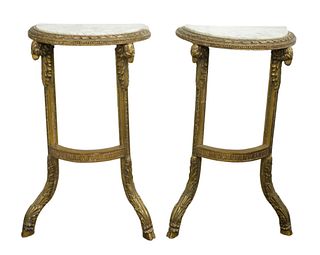 Pair of Marble Top Wall Mounted Demilune Tables, having carved rams head gilted base, height 32 inches, width 18 1/2 inches, depth 9 1/2 inches. 