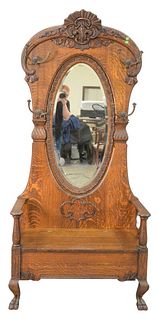 Victorian Quarter Sawn Oak Hall Rack, having oval beveled mirror lift seat and hoof feet, probably original finish, height 85 inches, width 39 inches,