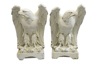 Pair of Large Eagles on Square Bases, enameled over sandstone/terracotta, probably 19th century, height 34 inches, (some chips).