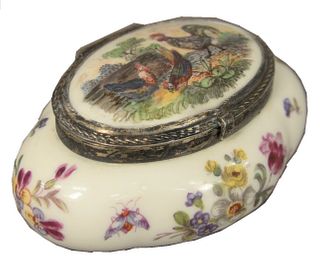 French Porcelain Bonbonniere Box, having silver hinged cover frame, height 1 1/4 inches, length 2 1/2 inches.