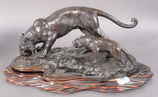 Japanese School (20th century), figural sculpture of two tigers on the edge of water, bronze with brown patina, inscribed with characters to the base,