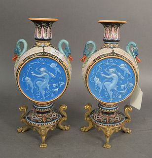 Pair of French Montereau Majolica Urns, having mounted swan handles and brass sphinx and lion feet ending in claw feet, height 14 inches, width 6 1/2 