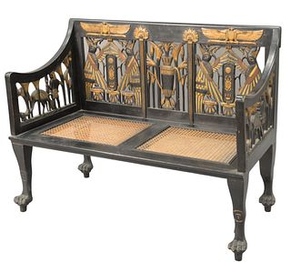 Egyptian Revival Ebonized Settee, having pierced, carved back and arm supports with caned seats and paw feet, height 37 inches, length 49 inches, dept