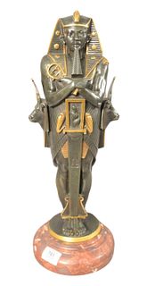 Egyptian Revival Style Bronze, of Pharaoh standing on a rouge marble base, unmarked, height 19 inches, width 6 1/2 inches.