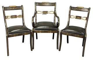 Set of Twelve Regency Style Chairs, ebonized and parcel gilt with stenciled decoration, to include two arm chairs and ten side chairs (one with repair