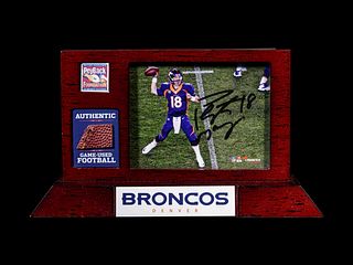 A Peyton Manning Signed Photograph and Game Used Football Fragment (Fanatics),