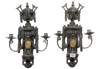 Pair of French Carved Wood and Gesso Sconces, having two arms each and a figural medallion to the center of each, height 19 inches, width 13 inches.