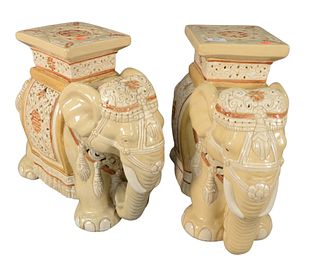 Pair of Glazed Ceramic Garden Seats, in the form of elephants, height 17 inches, length 20 inches, width 7 1/2 inches.
