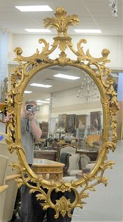 Gilt Decorated Oval Mirror, height 56 inches, width 30 inches.