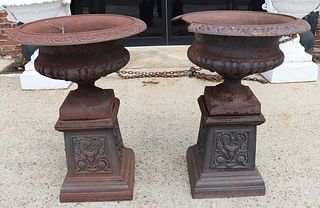 A Vintage Pair Of Cast Iron Urns On Stands.