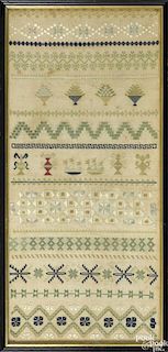 English silk on linen band sampler, 18th c., 22'' x 10''.