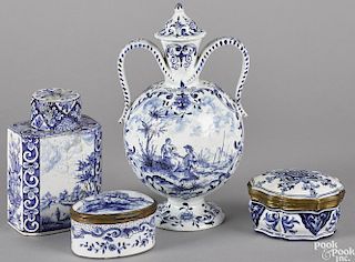 Four Delft blue and white wares, 18th c., to include a twin-handled bottle, 9 1/4'' h., a tea caddy