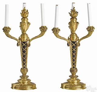 Pair of French Empire gilt bronze three-light candelabra with flame finials, 21'' h., 11'' w.