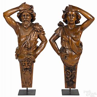 Pair of French carved walnut figureheads of a man and woman 19th c., 43'' h.
