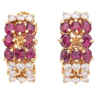 PAIR OF EARRINGS WITH RUBIES AND DIAMONDS IN 18K YELLOW GOLD 16 Oval cut rubies ~1.60 ct and 22 Brilliant cut diamonds ~0.88 ct