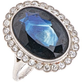 RING WITH SAPPHIRE AND DIAMONDS IN PLATINUM 1 Oval cut sapphire~8.0ct and 28 Diamonds (different cuts)~0.60ct. Weight: 7.3 g. Size:6½