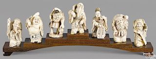 Set of seven Japanese Meiji period carved and polychrome decorated ivory figures, 3'' h.