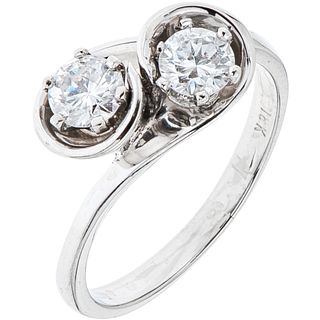 RING WITH DIAMONDS IN 18K WHITE GOLD 2 Brilliant cut diamonds ~0.56 ct Clarity: SI2. Weight: 4.1 g. Size: 6 ¼