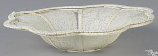 Chinese carved ivory basket, late 19th c., with a double-swing handle, 2'' h., 10'' w.
