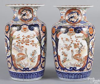 Pair of Japanese Imari palette porcelain urns, 19th c., 15'' h.