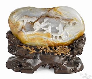 Chinese carved celadon and russet jade mountain, with stand - 7'' x 8''.