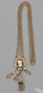 Victorian yellow gold slide chain with four tassels and a shell cameo, 36.3. dwt