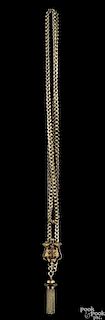 Victorian 10K gold chain with a 14K yellow gold slider with black line tracery and a single tassel, 39.1 dwt.