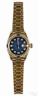 Lady's Rolex Oyster Perpetual Date gold wristwatch, 18K with a diamond and sapphire bezel